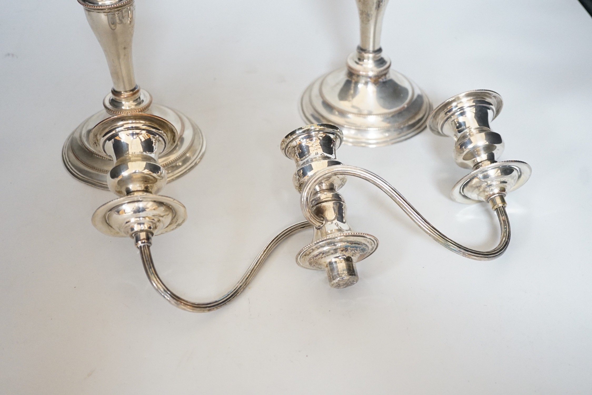 A pair of silver plated candelabra